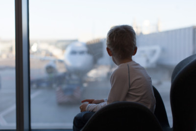 Child at airport looking at planes